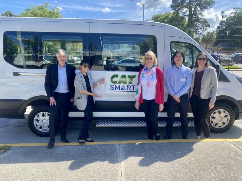 Pascal and the team standing in front of a smart van in Savannah